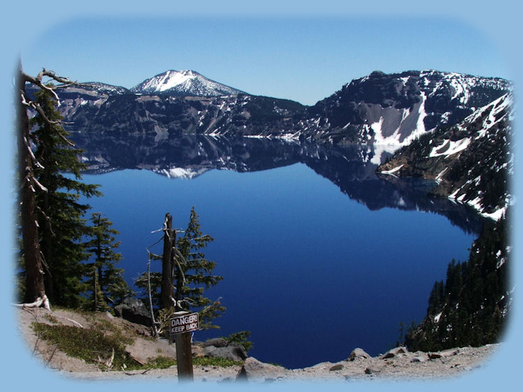 crater lake photographed from the western rim at crater lake national park in the cascade mountains of oregon: hiking trails up garfield peak, godfrey glen, watchman tower, cleetwood trail down the rim to the lake and boat rides, up mt scott.