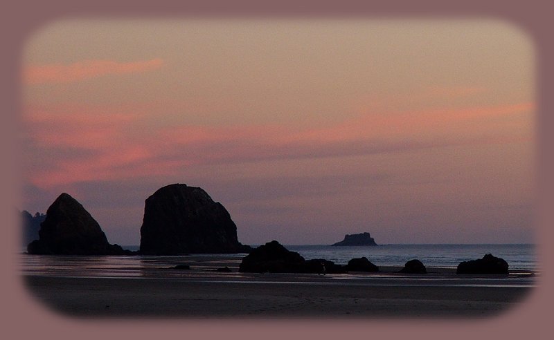 sunset at tolovana state park at cannon beach on the oregon coast.