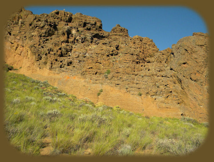 
fort rock state park on the oregon outback scenic byway, an ancient volcanic outcropping - a maar of tuff that today sits in the midst of cattle ranches, but was once surrounded by water from an ancient lake.