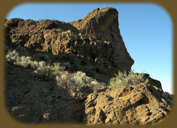 
fort rock state park on the oregon outback scenic byway, an ancient volcanic outcropping - a maar of tuff that today sits in the midst of cattle ranches, but was once surrounded by water from an ancient lake.