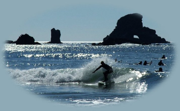 surfing at indian beach of ecola state park on the oregon coast.