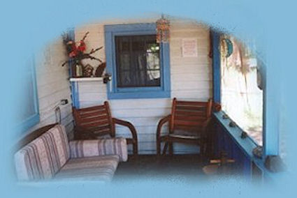 the porch on the cottage at gathering light ... a retreat in southern oregon near crater lake national park: cabins, tree houses in the forest on the river.